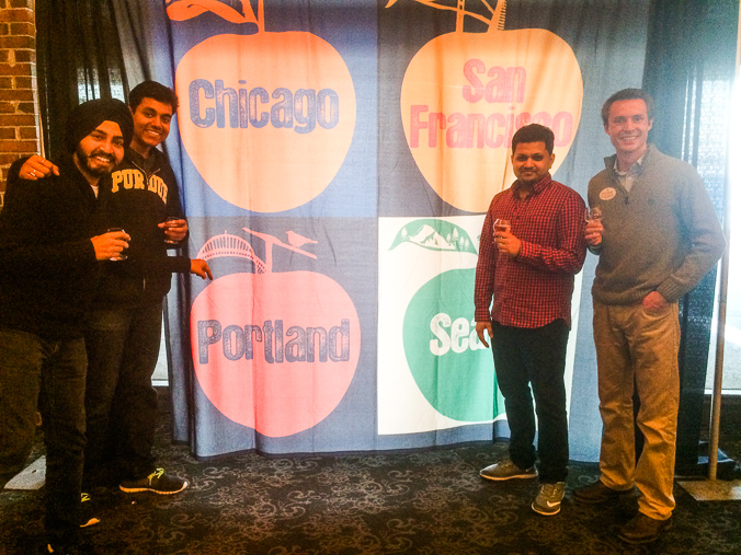 Vivek joins Pushpinder, Dhawal, and I in front of the Cider Summit banner. We took a picture with this banner (same one??) in Portland last summer!