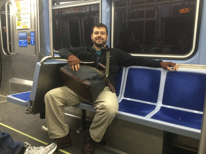 I take all my friends' pictures on transit. Here, Eric is enjoying his finger-less gloves on the southbound Red line.