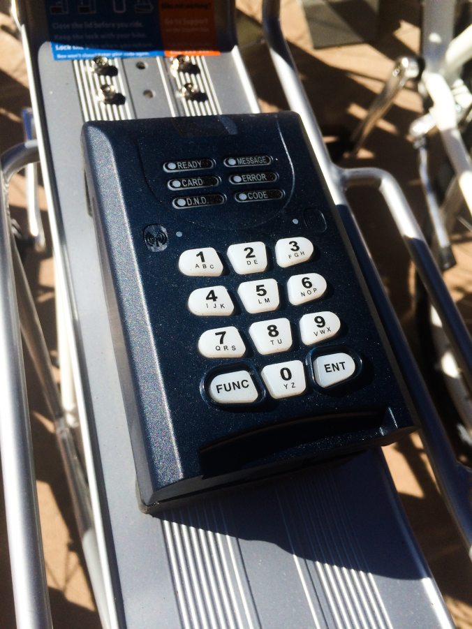 The keypad on the back rack of the bike.