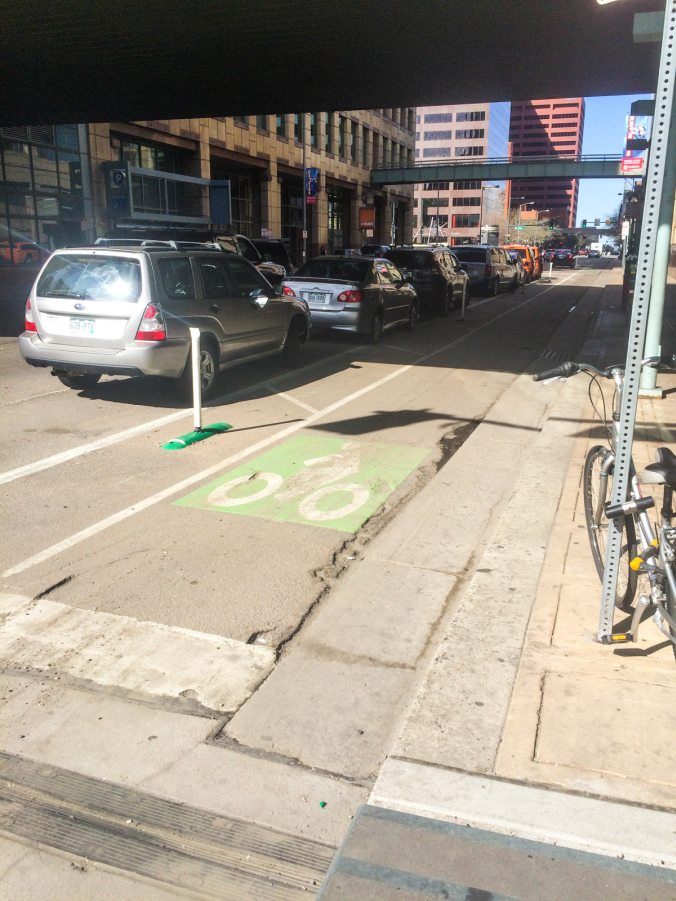 This semi-protected bike lane on Lawrence Street reminded us that on a day that a train stole the show, mobility options do not stop with heavy rail.