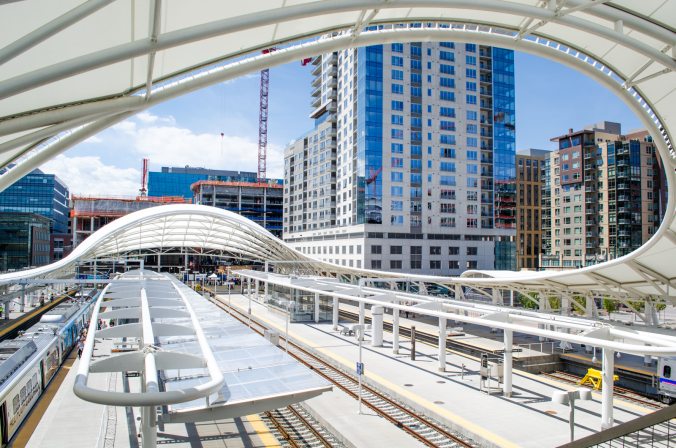 The tracks at Union Station have a neat roof structure! Which doesn't provide much actual roof-age. But it makes for cool photos! Two buildings in development can be seen at the end of the platforms, which will provide even more residential and retail buzz for the LoDo area.